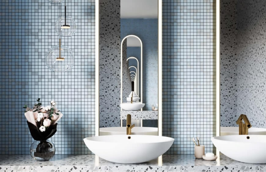 ikiz lavabolu ve terrazzo desenli tezgahi olan banyoda mavi tonlarda mix and match kucuk duvar karosu 
