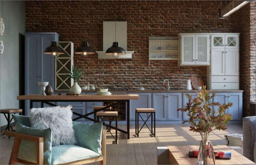 acik planda mutfak ve oturma alani bir arada, tugla tezgah arasi ve mavi mutfak dolaplari ve bar masasi 